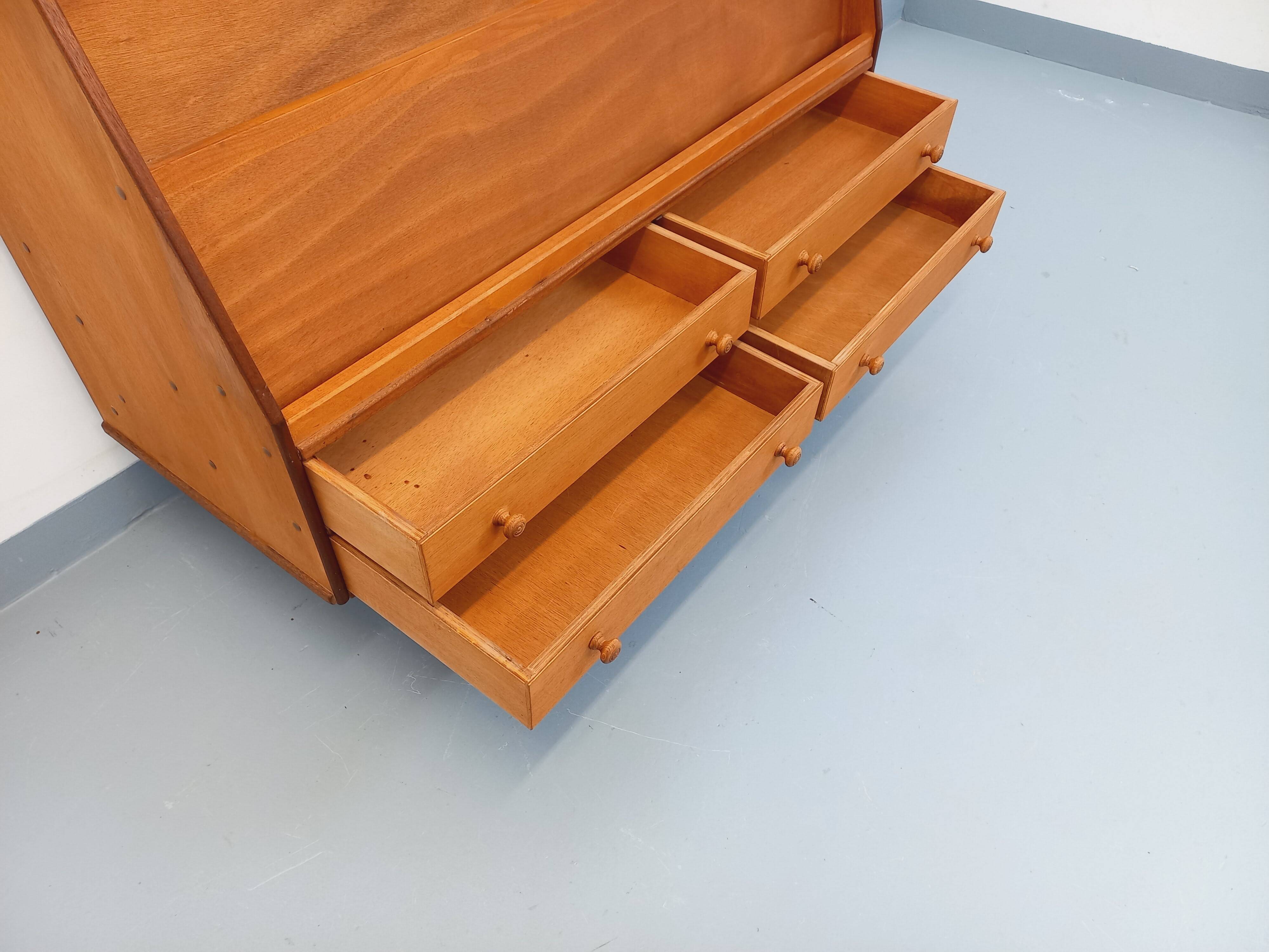 Vintage wooden display bookshelf with drawers from the 1960s.