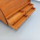 Vintage wooden display bookshelf with drawers from the 1960s.