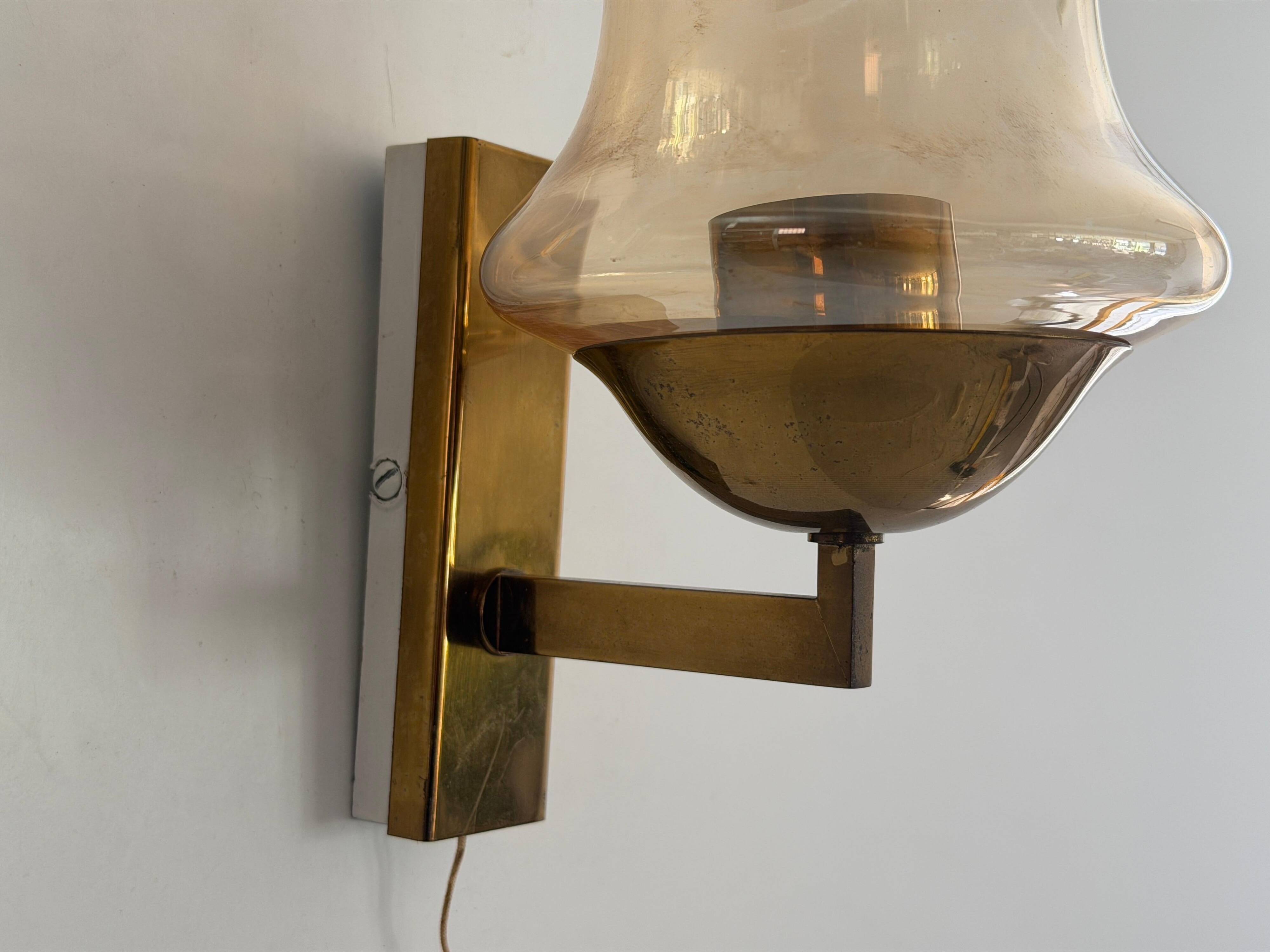 Yellow glass and brass wall light from the mid-century, 1960, Germany.