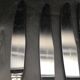 9 table knives in silver metal.