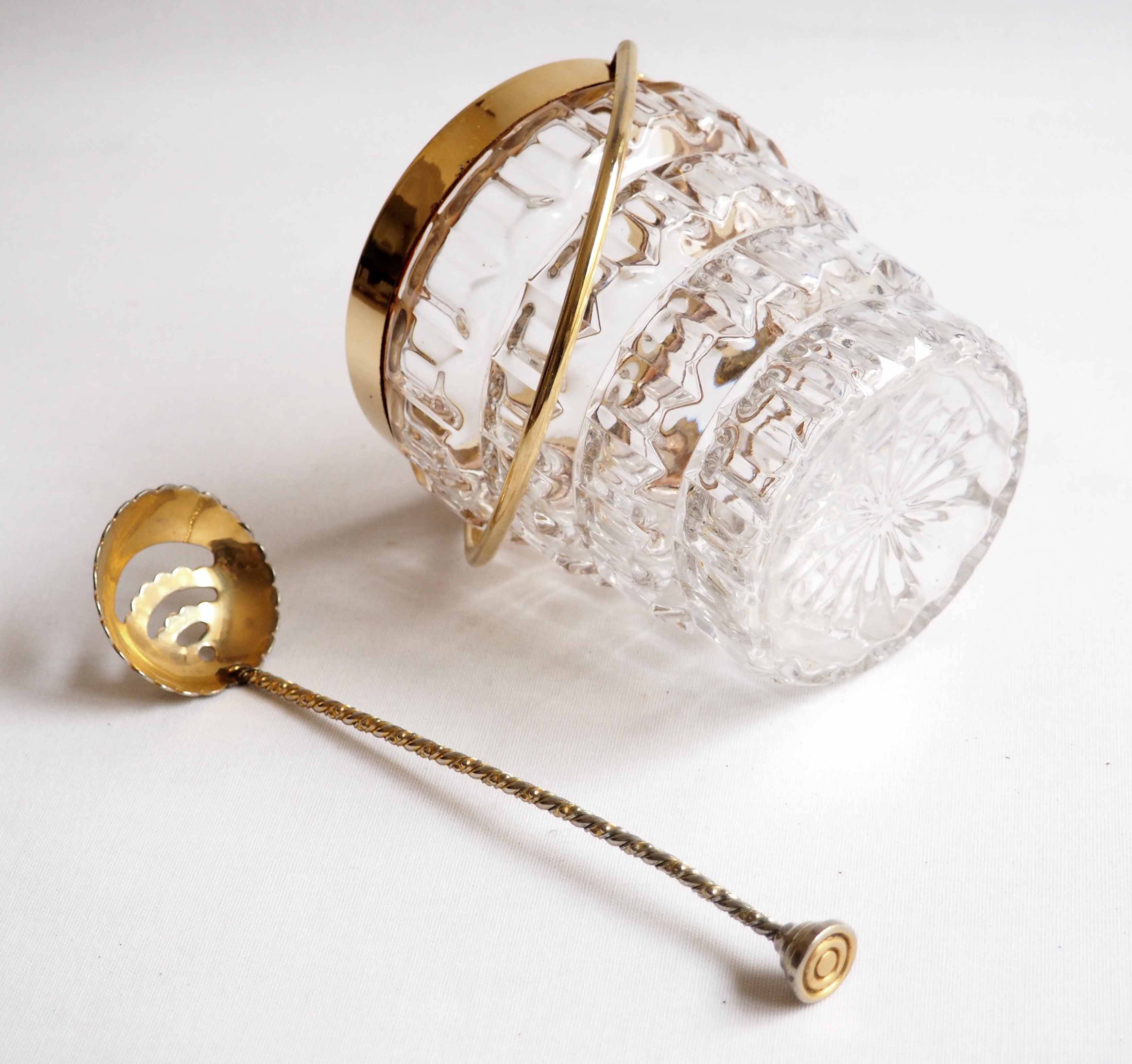 Crystal ice bucket and golden ladle