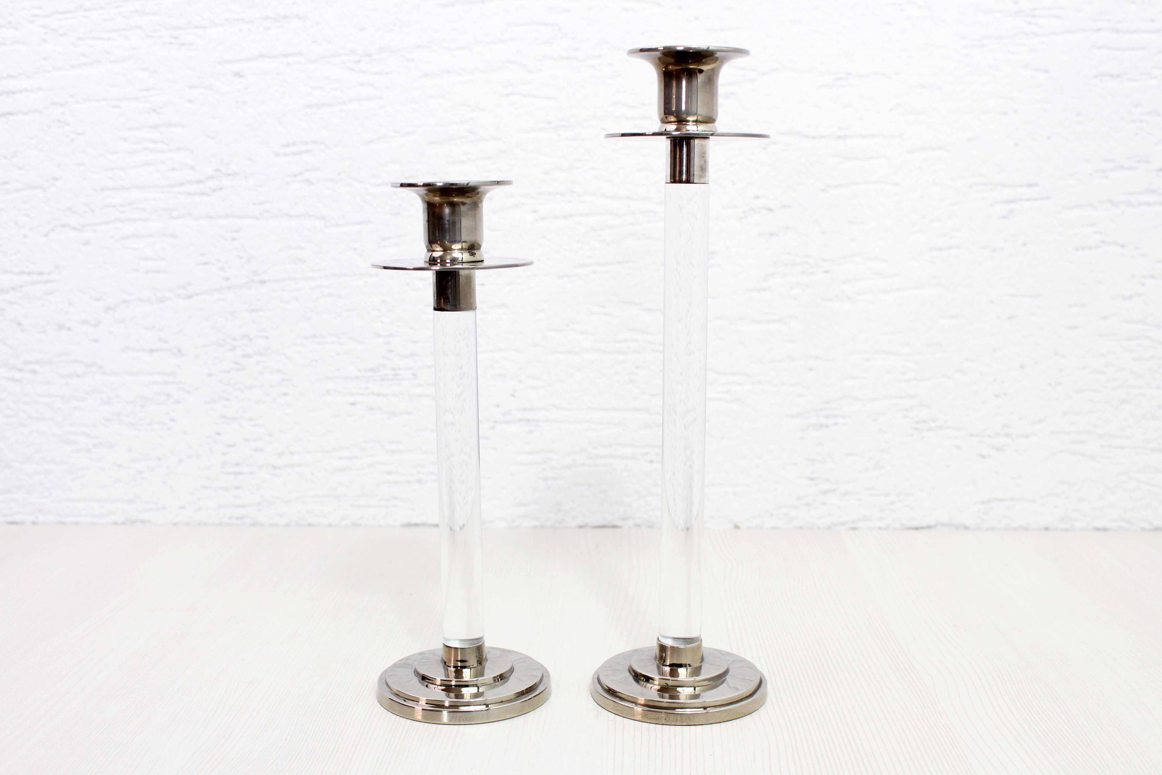 Pair of lucite and silver-plated metal candlesticks