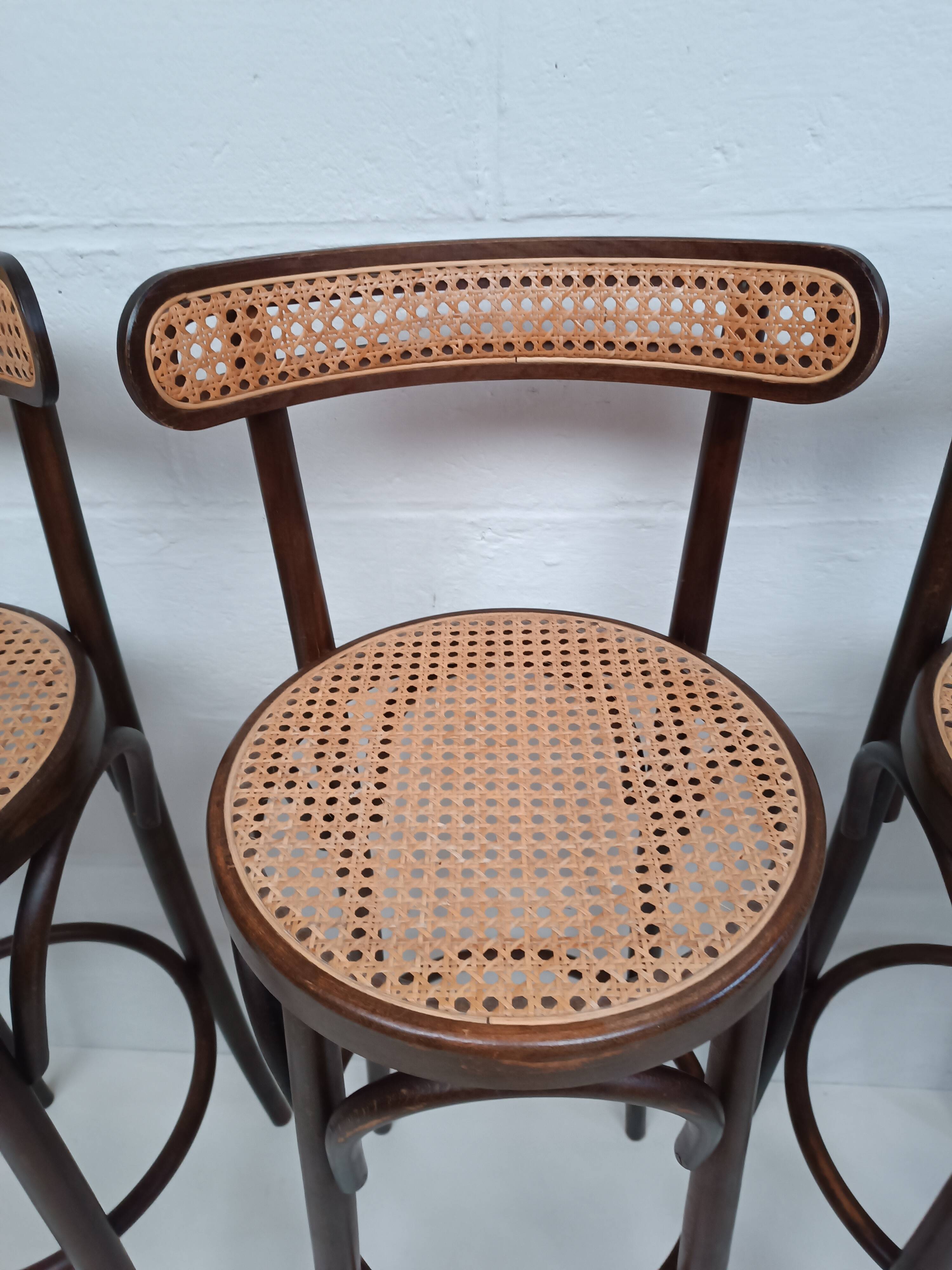 4 curved wood and cane bar stools