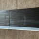 Pair of contemporary shelves in steel and stained wood