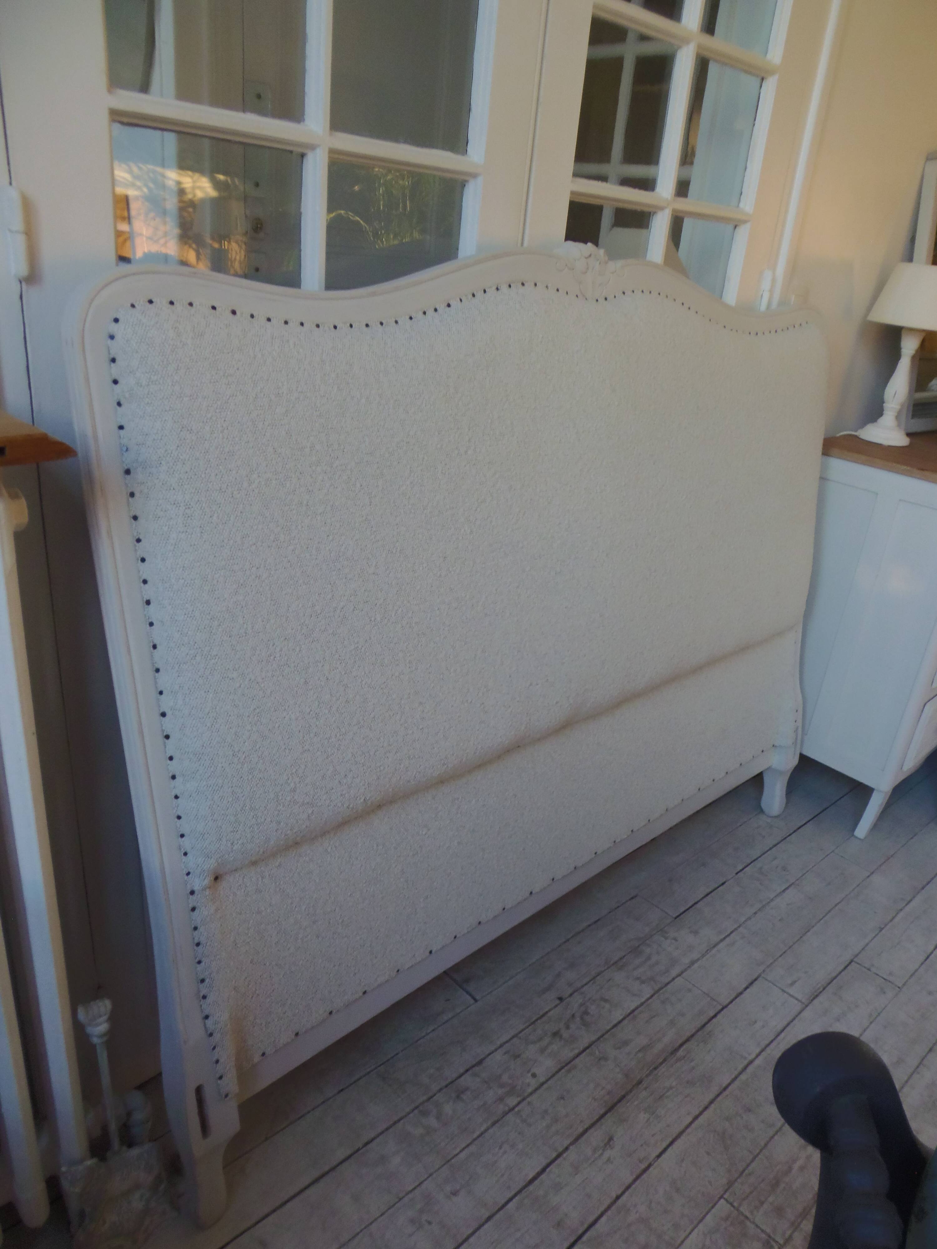 Louis XV style headboard with pearl grey patina, upholstered in off-white bouclette.