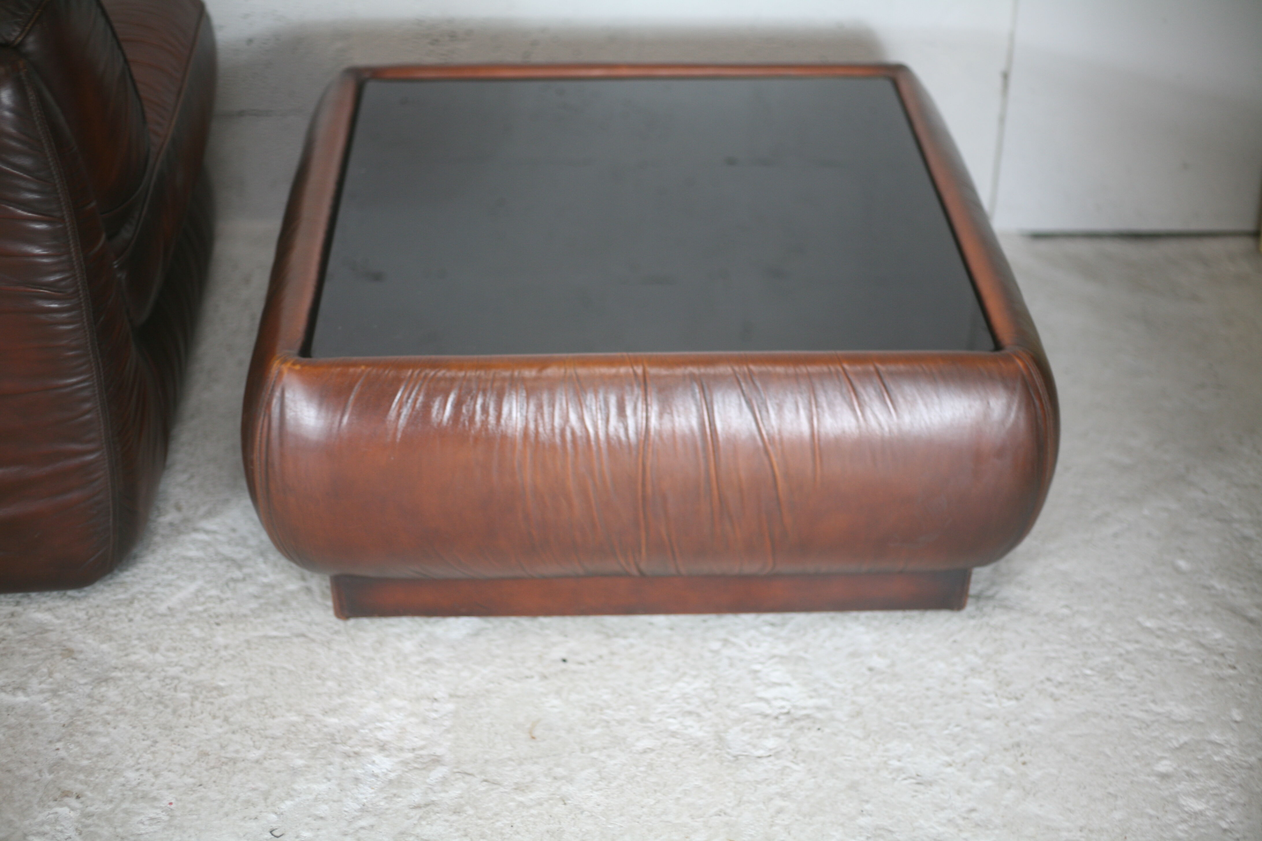 Leather armchair and coffee table set, Italy, circa 1970. Space Age