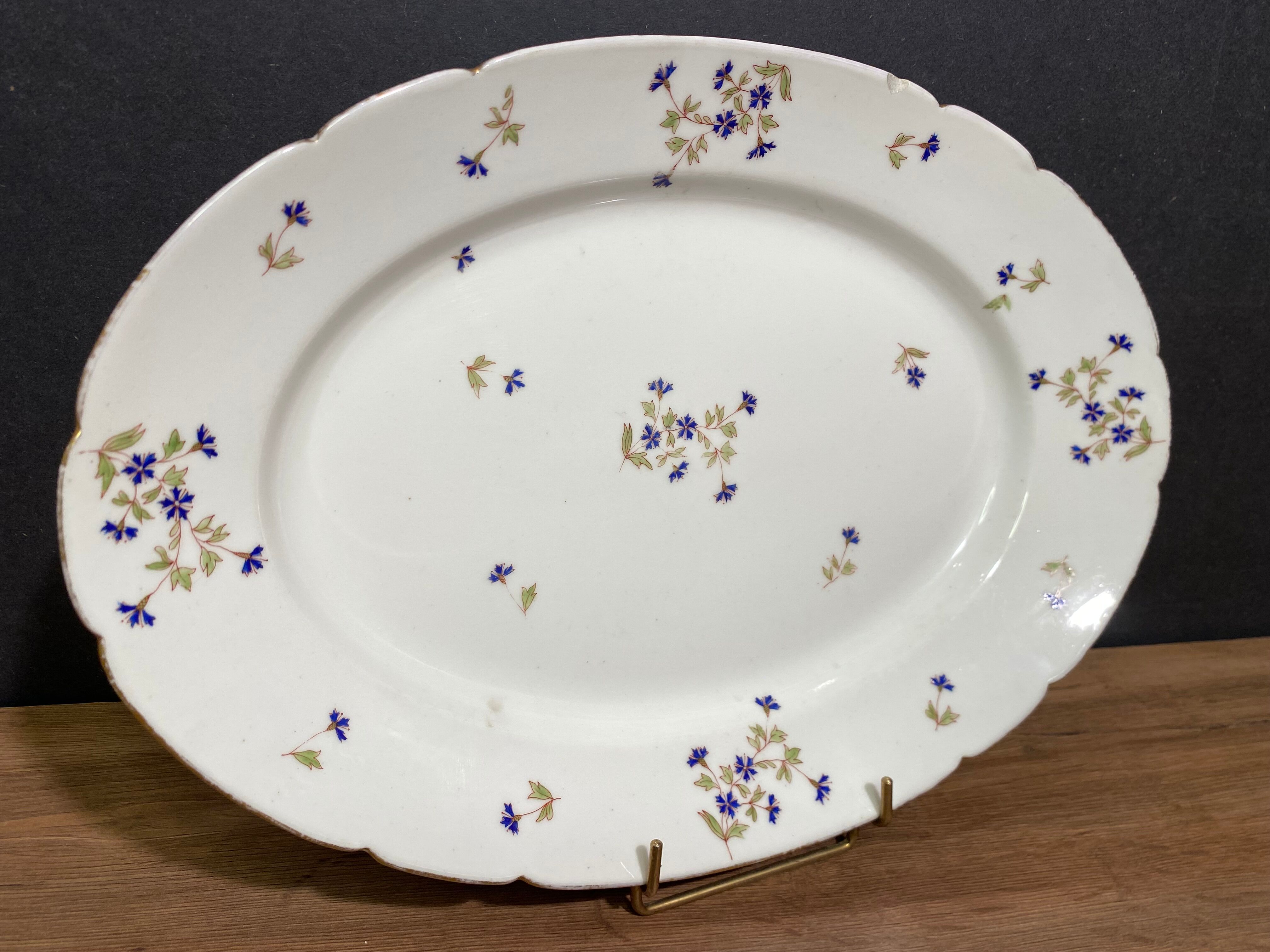 Oval-shaped dish in Limoges porcelain decorated with barbels Louis XV style