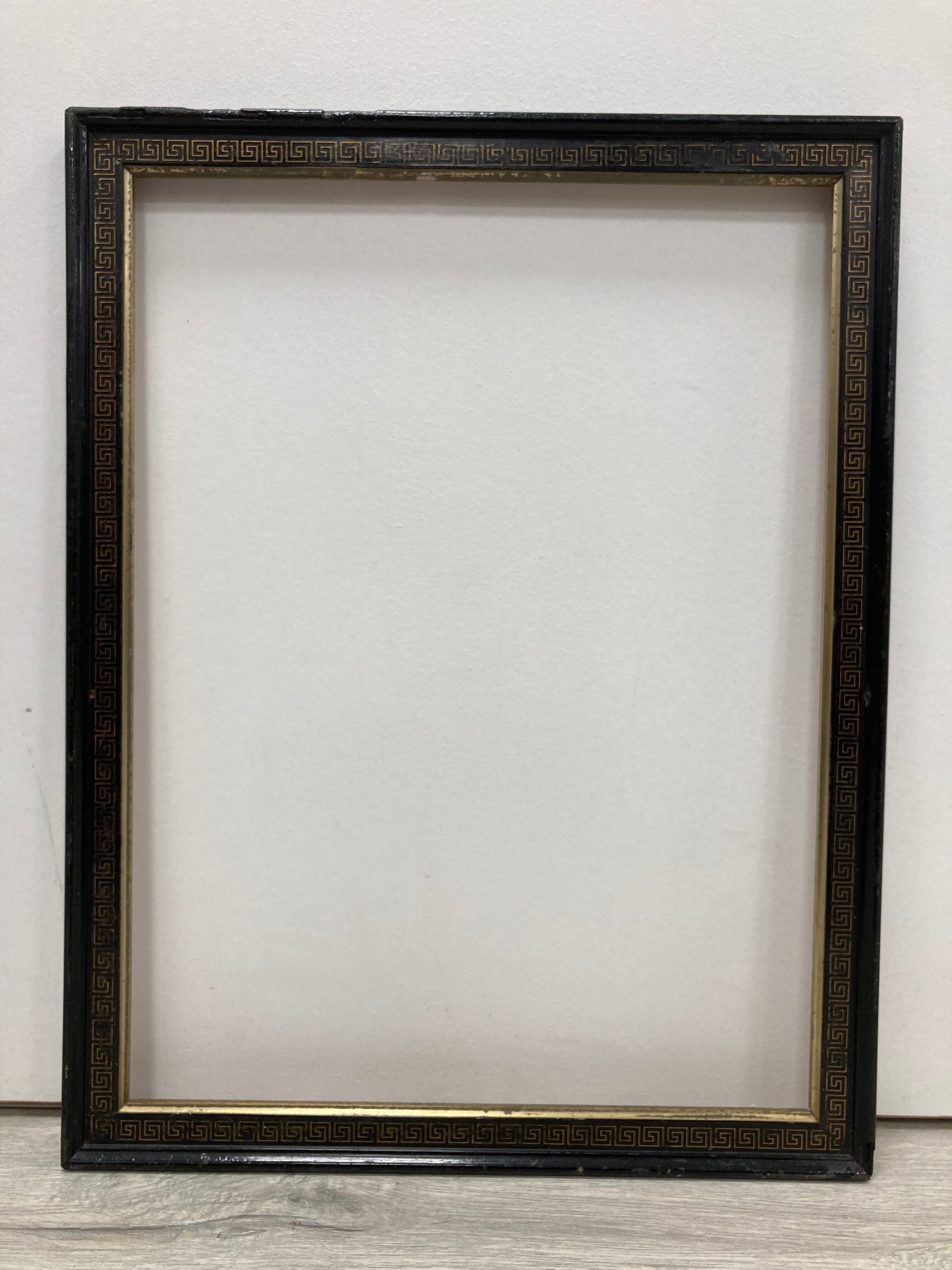 Black and gold frame decorated with Greek frieze decoration