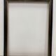 Black and gold frame decorated with Greek frieze decoration
