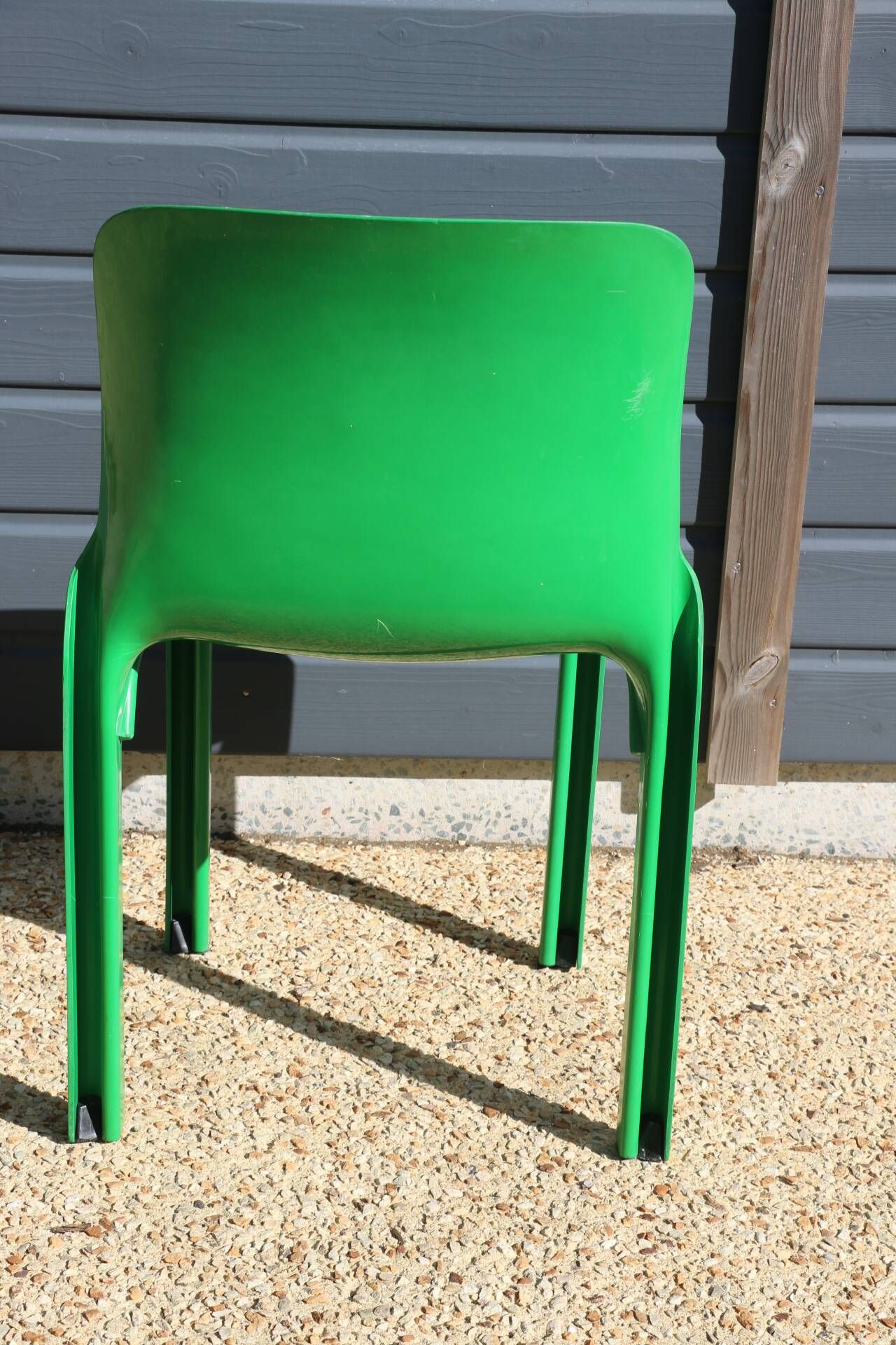 Set of 4 green Selene Magistretti chairs.