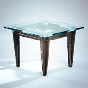 2 brutalist steel side tables with primitive  scene motifs etched glass