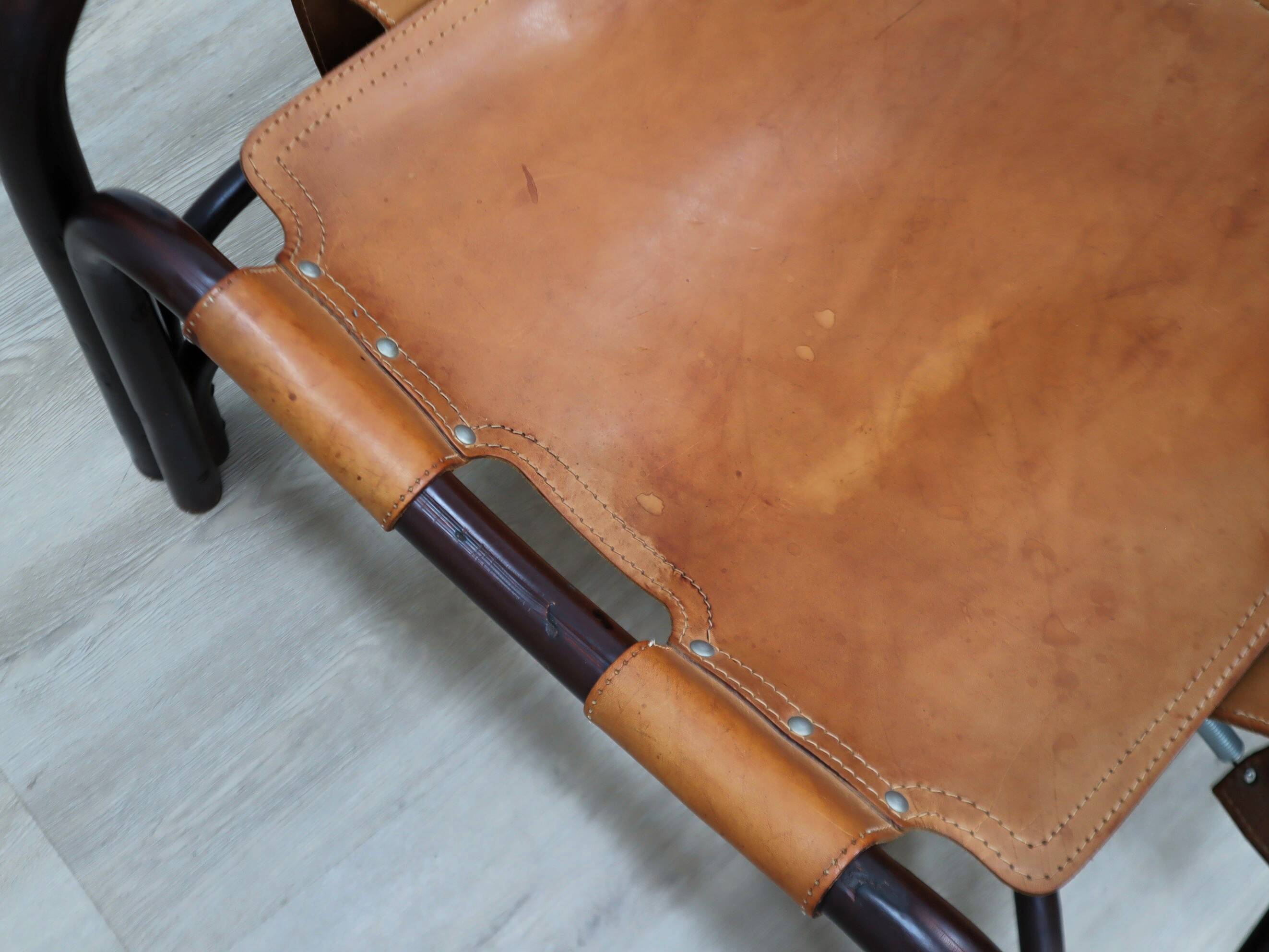 A vintage Tito Agnoli armchair leather and bamboo 1960s