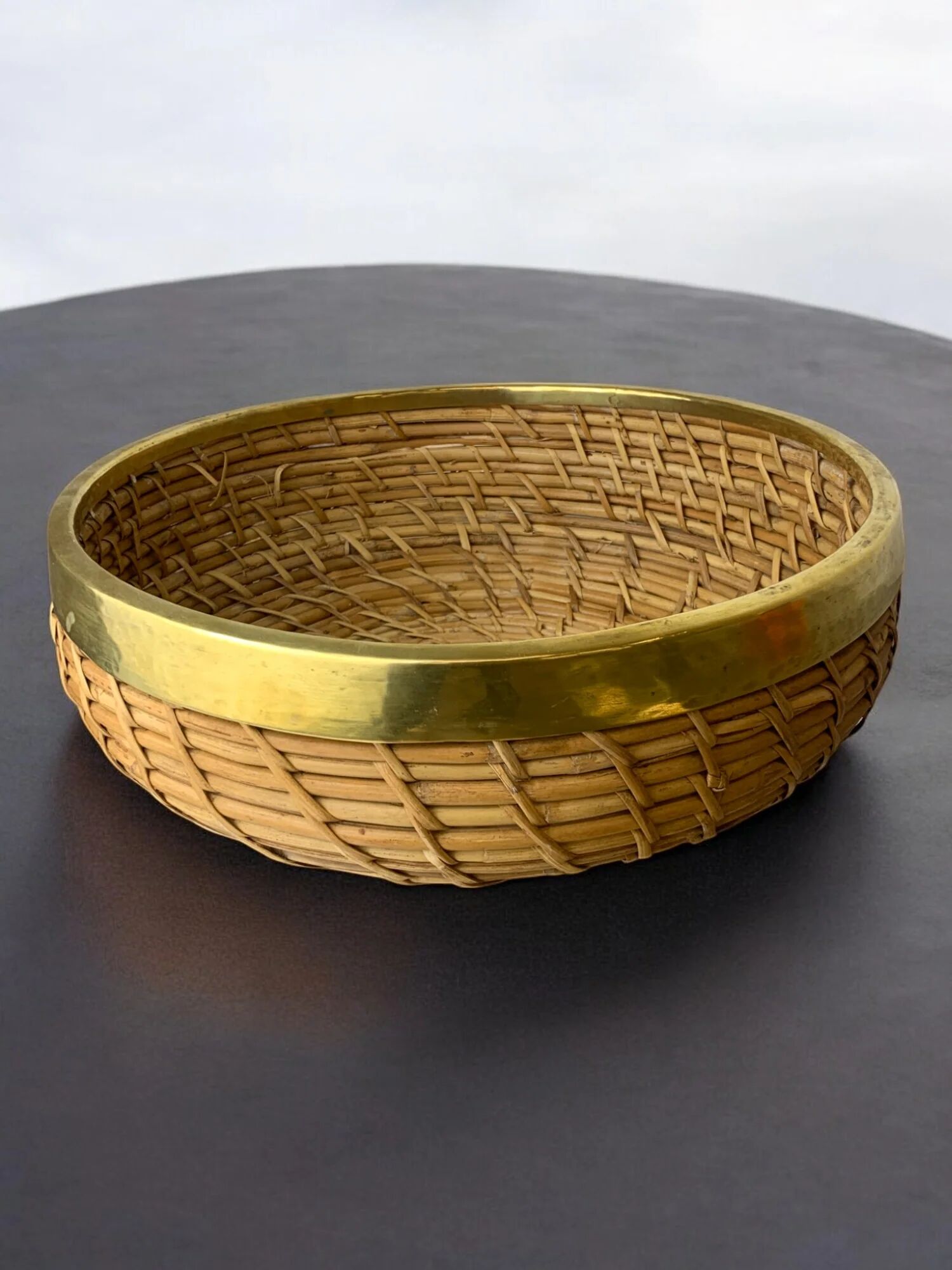 Circular rattan and brass basket, Italy, 1970s, 35 cm diameter