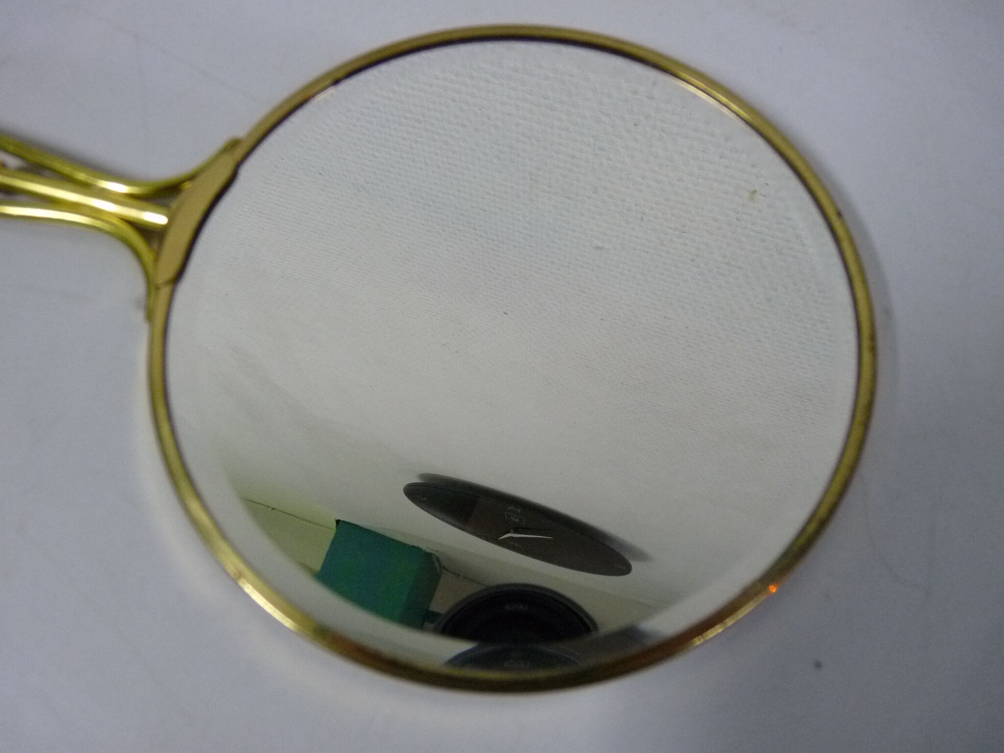 Old mirror double face with golden hand