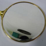 Old mirror double face with golden hand