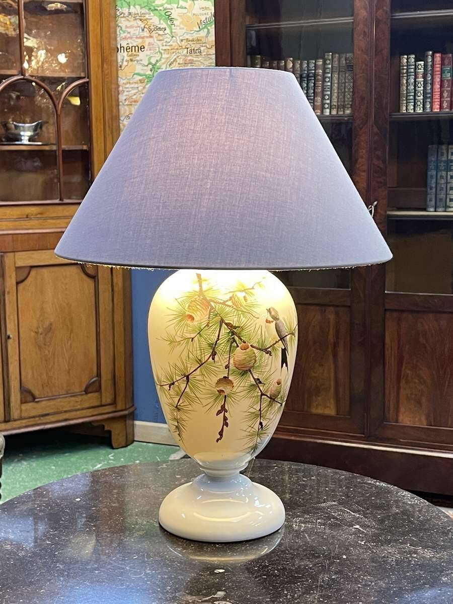 Napoleon III lamp in white opaline glass with bird decoration from the late 19th century