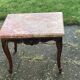 Carved wooden coffee table with shell pattern and removable pink marble top, old