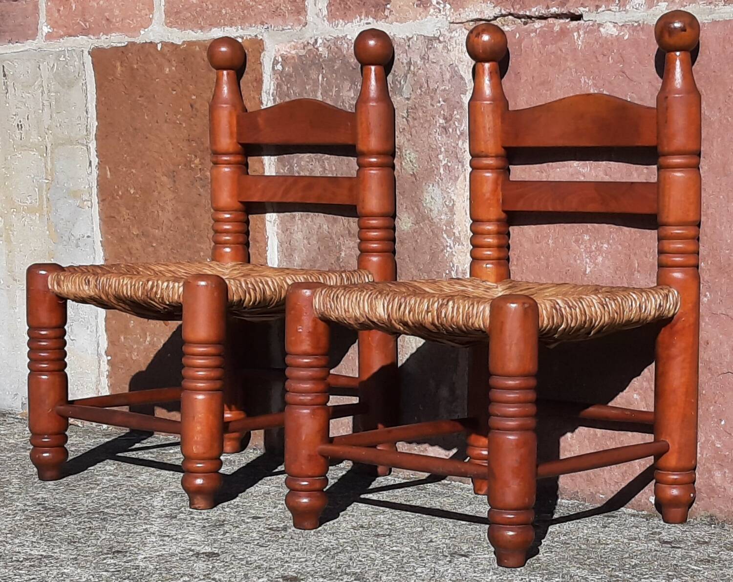 Pair of low armchairs by the fireplace. (Straw seat)