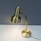 Older Swedish table lamp, estimated 1980s, in gold-colored aluminum with “bend”.