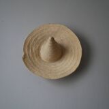 Hand-woven wicker straw hat, artisanal production, decorative object, bohemian ethnic countryside