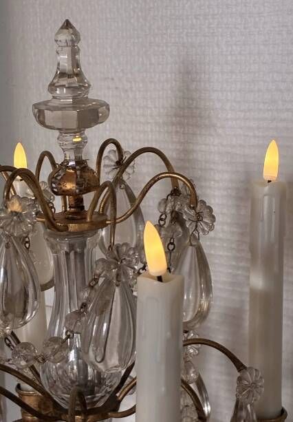 Candle holder or candelabrum with four arms of light.