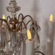 Candle holder or candelabrum with four arms of light.