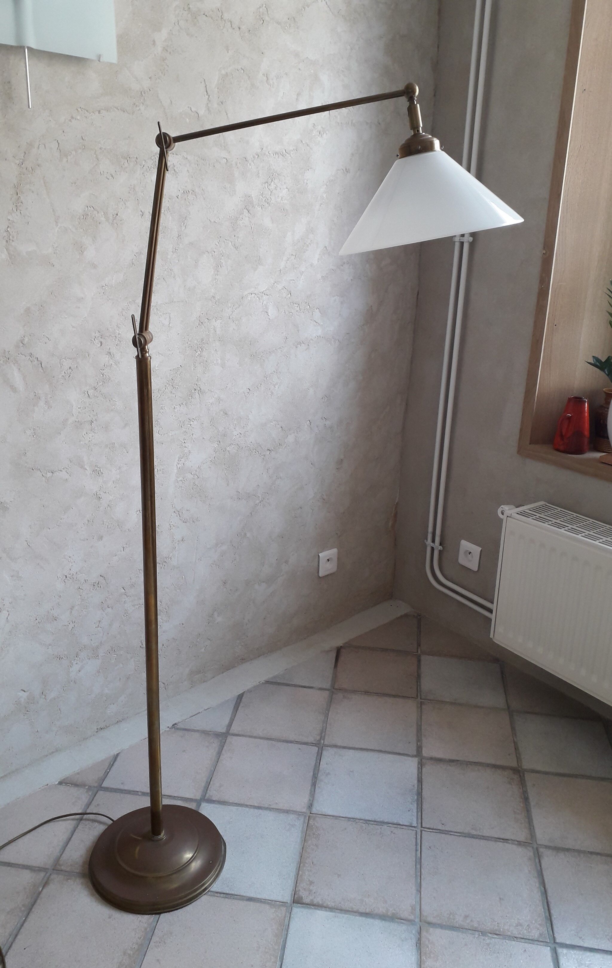 Articulated brass floor lamp