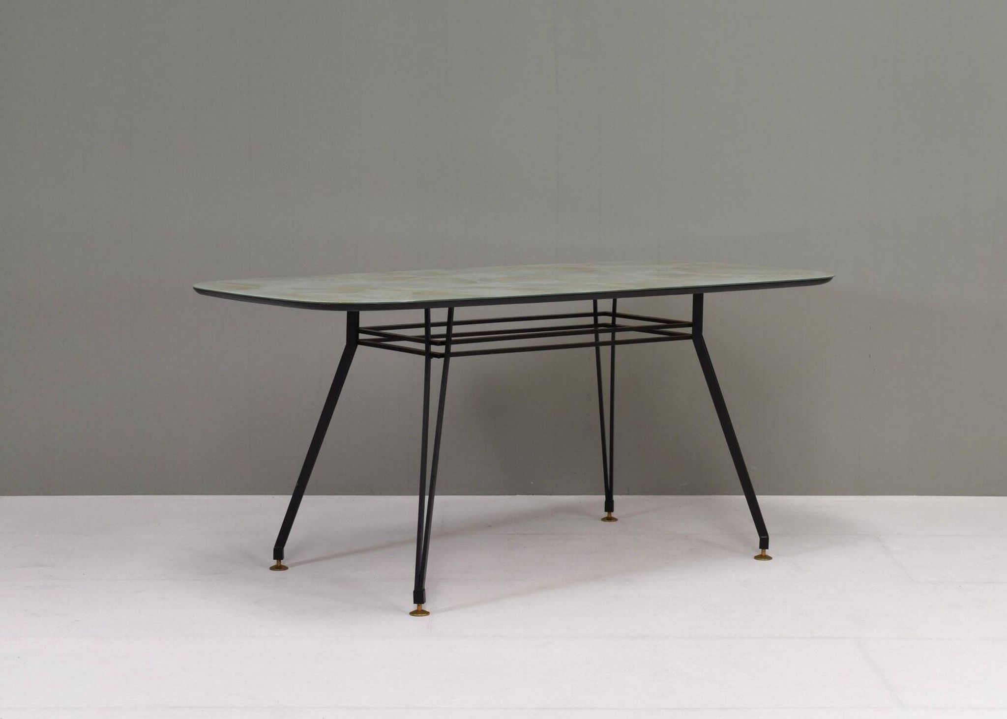 Italian dining table with metal base and glass top and brass, 1950s