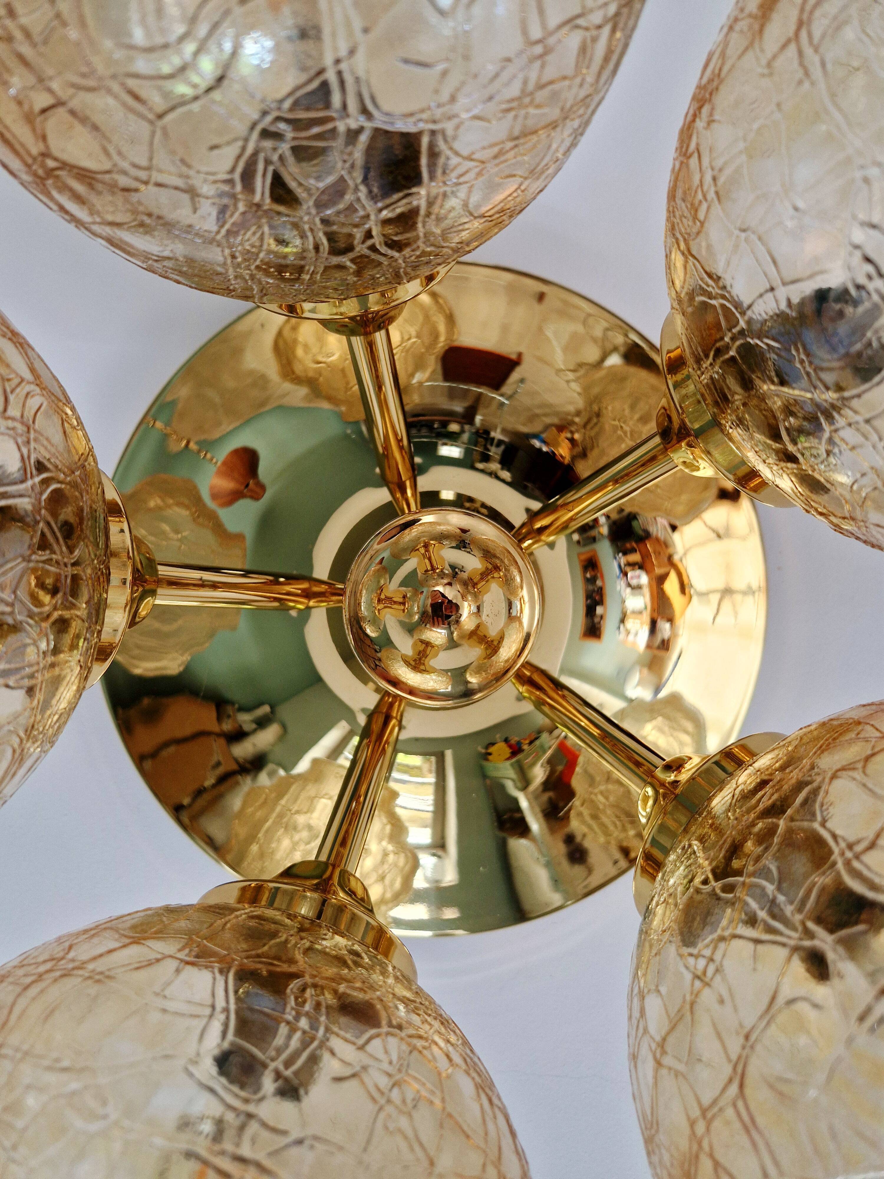 Large designer ceiling light in brass and amber crackled glass, 1970s.