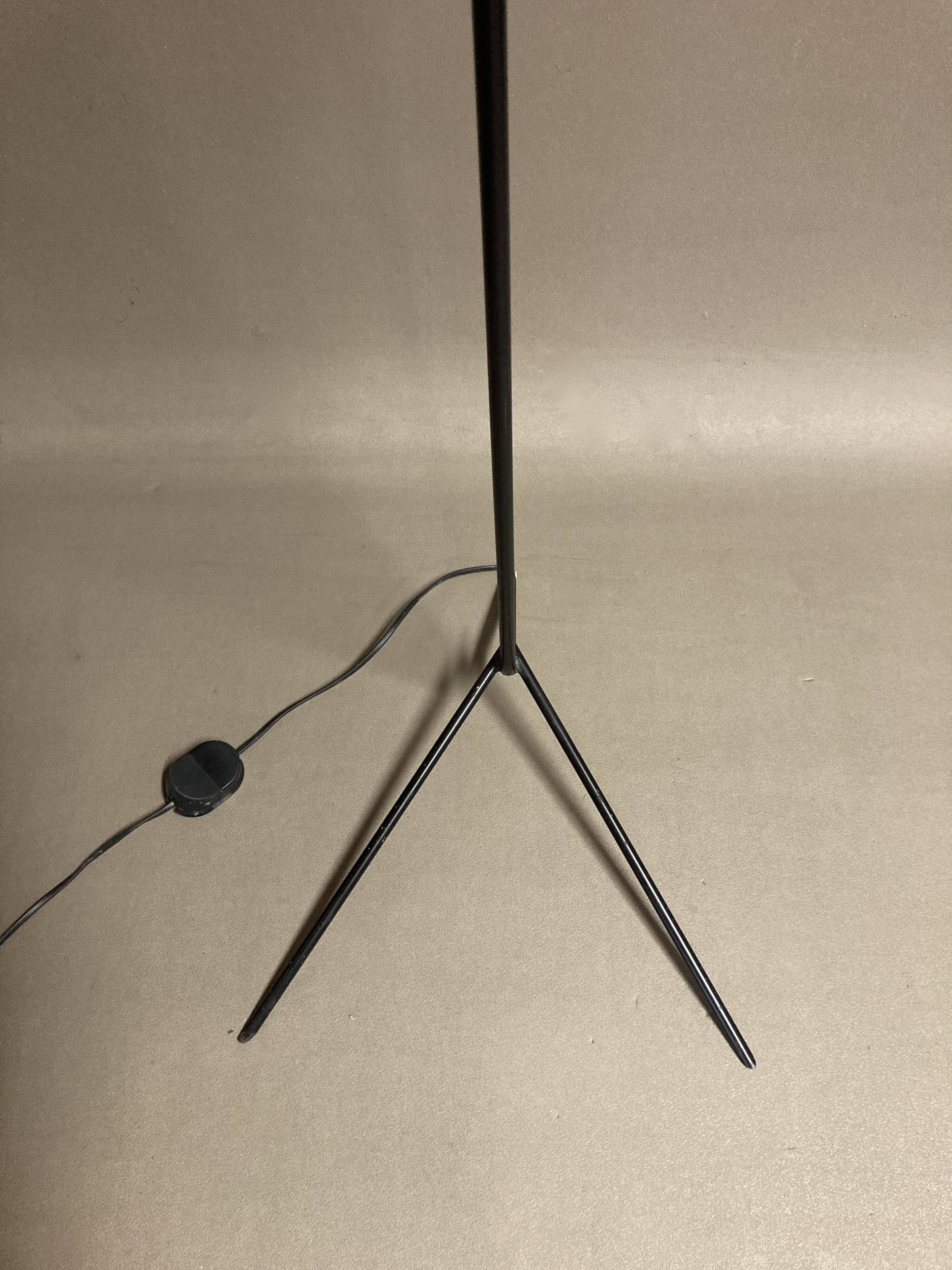 Black metal tripod floor lamp