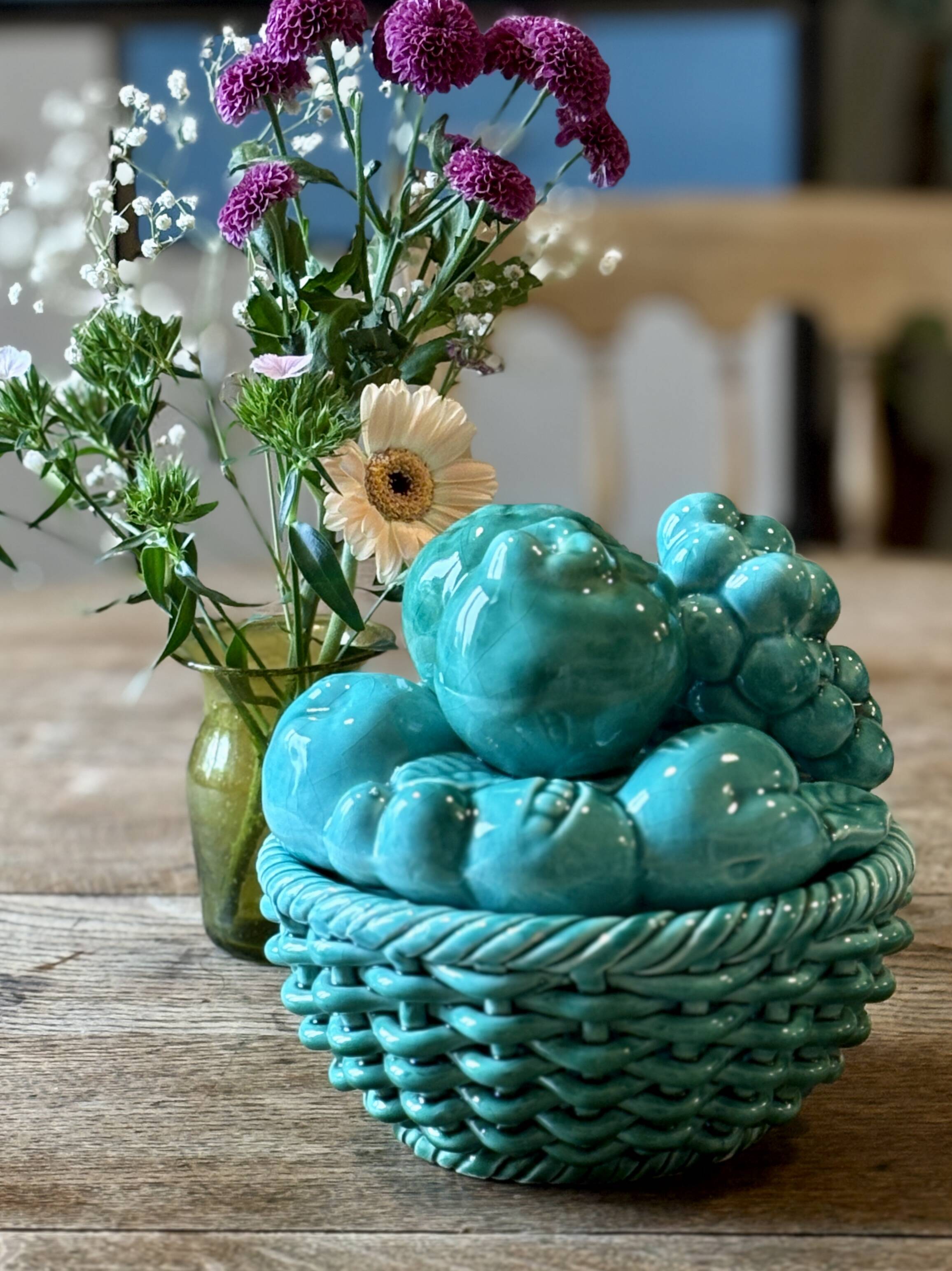 Vintage green earthenware plate/basket with fruit decorations.
