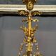 Golden bronze chandelier in Louis XVI style. 12 light points.