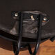 Fauteuil noir pieds en arc