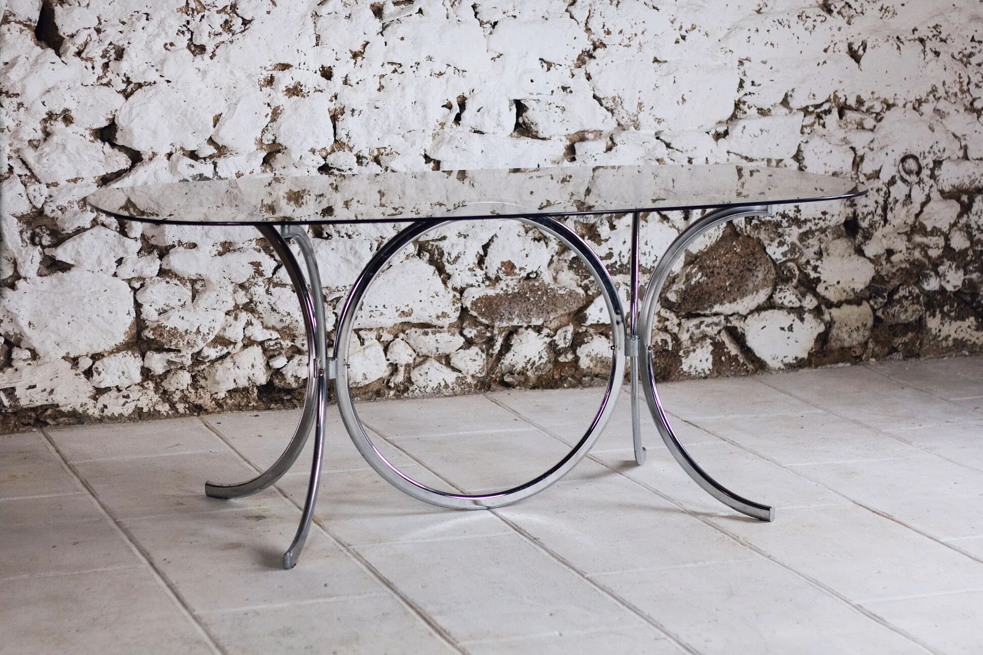 Chrome and smoked glass dining table in the style of Gastone Rinaldi, 1970.