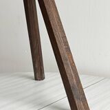 Small dark wooden tripod stool