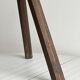 Small dark wooden tripod stool