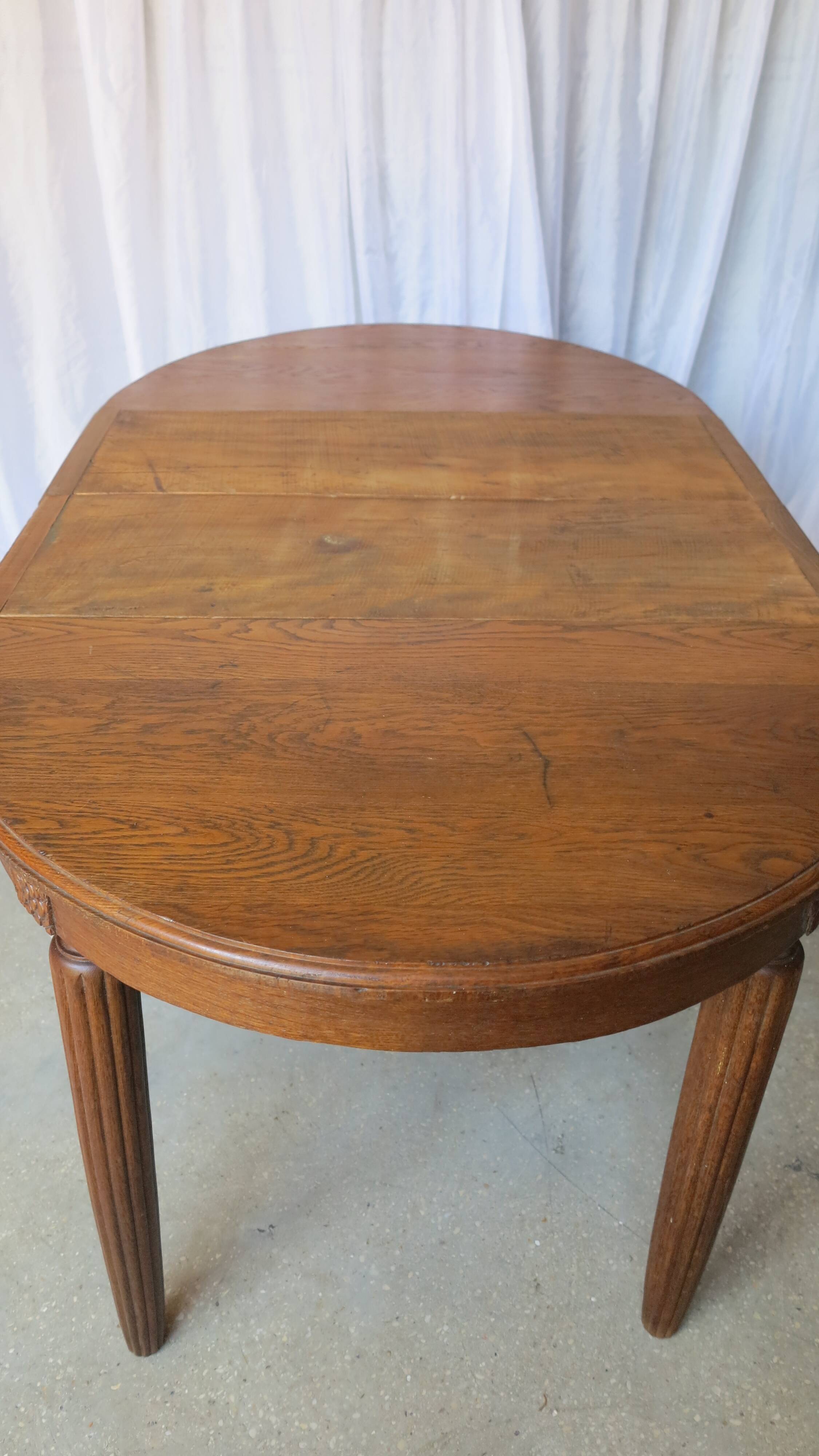 1930s oak dining table, slightly oval.