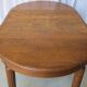 1930s oak dining table, slightly oval.