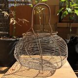 Old egg basket in metal shape round metal handle