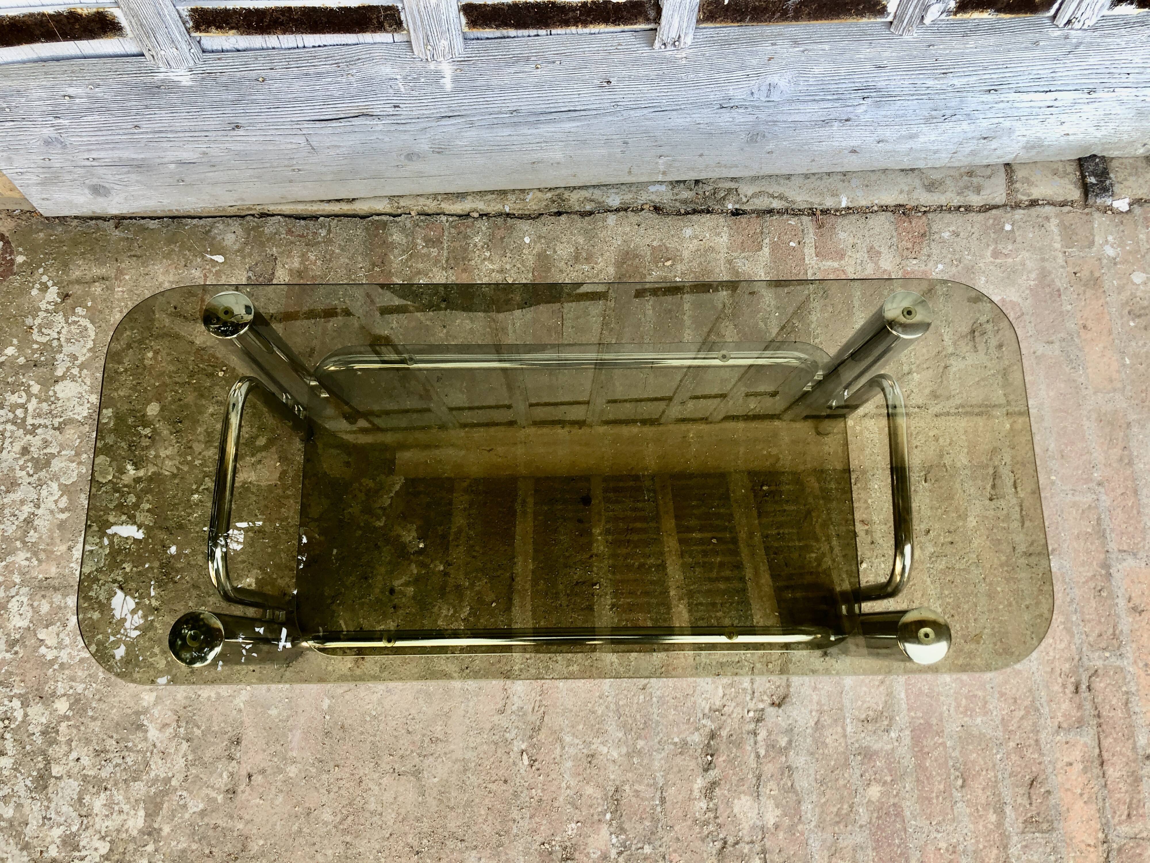 Coffee table chrome tubes and smoked glasses 1970