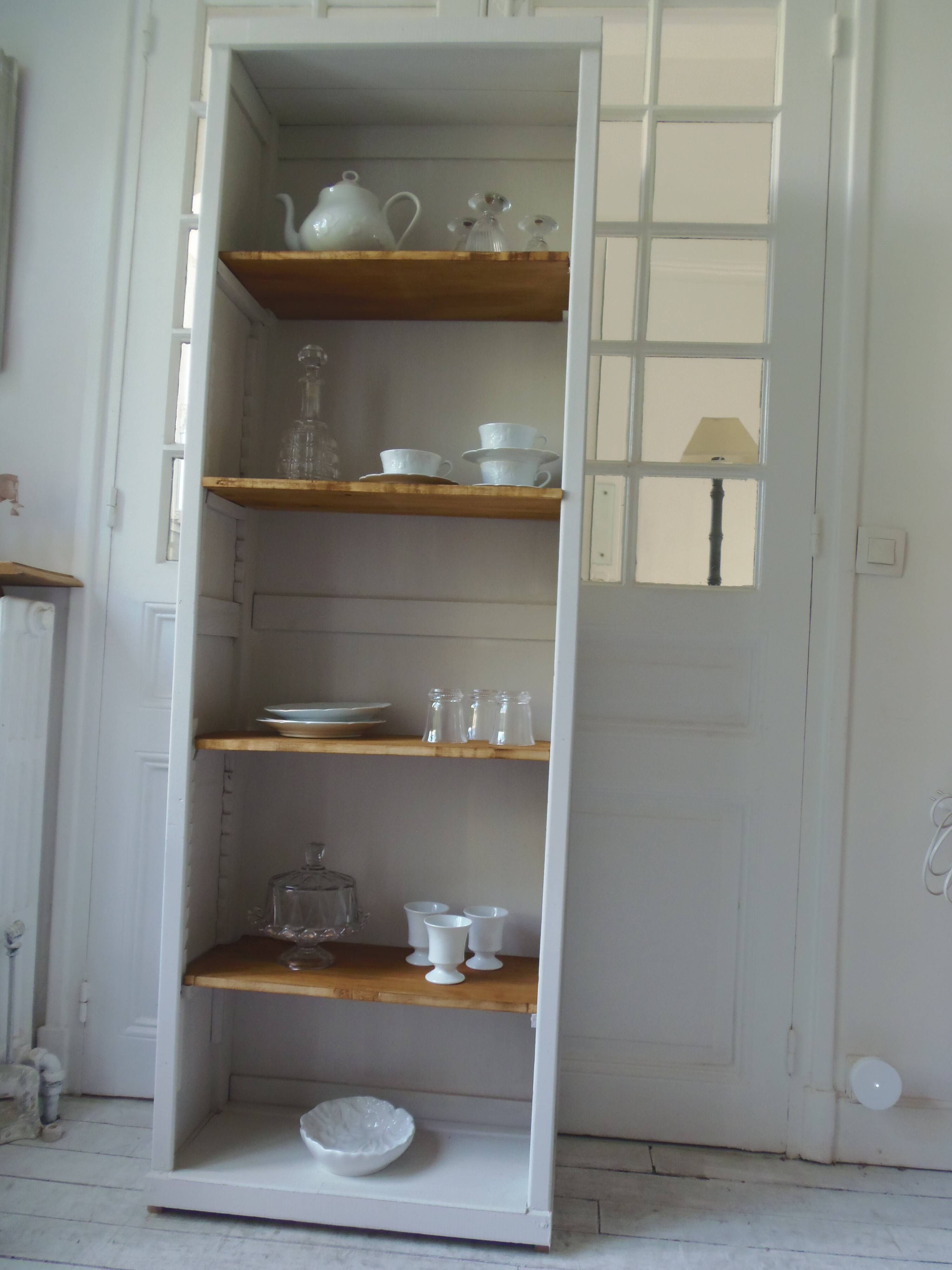 Shallow depth bookcase re-enchanted in pearl gray, wooden shelves.
