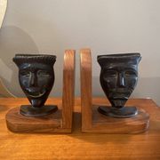 Pair of bronze bookends with masks