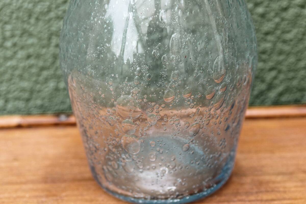 Biot blown glass bottle
