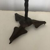 Old and patinated metal candlestick