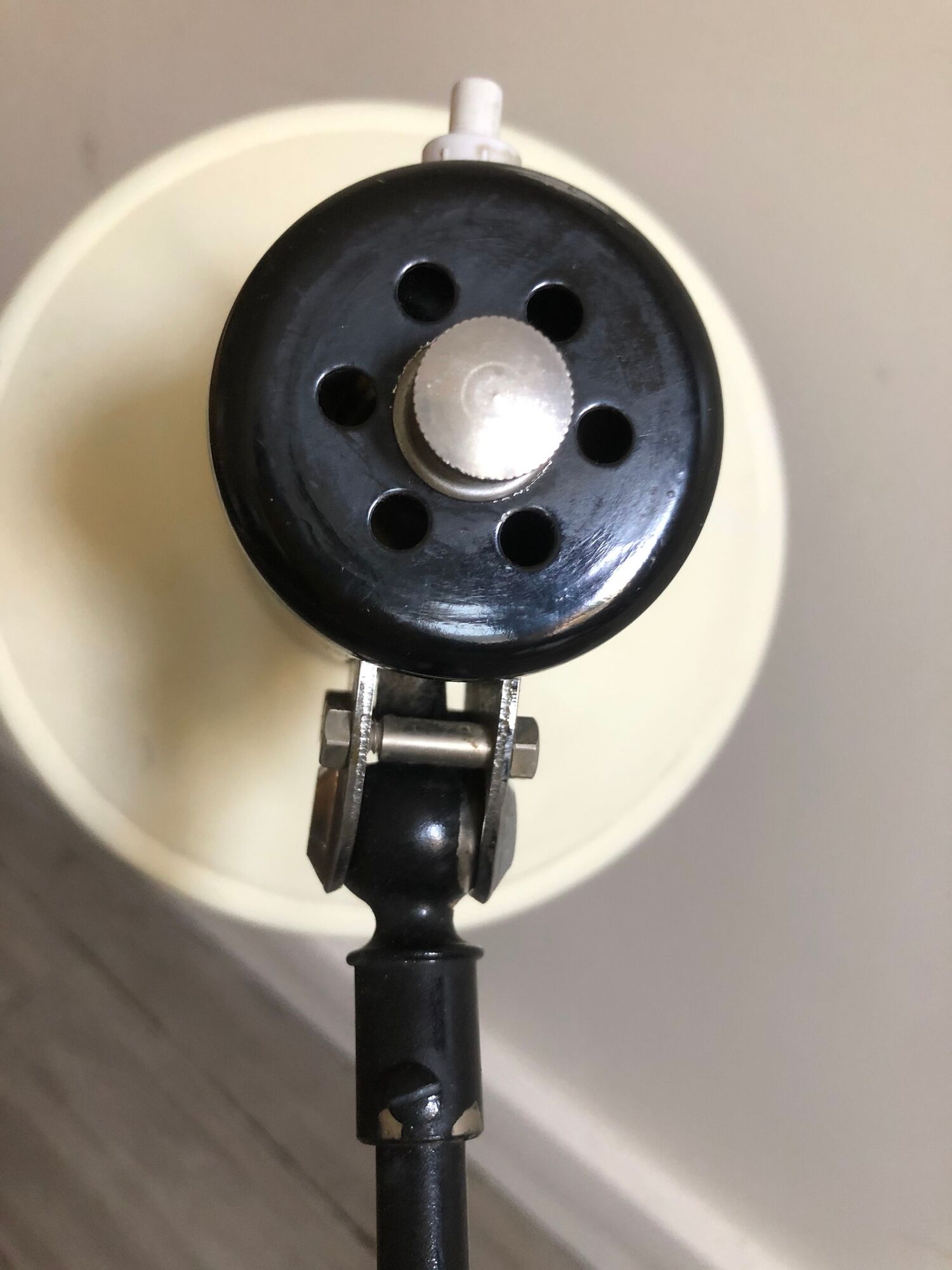 Desk lamp has two articulated metal arms