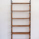 Woven rattan shelf and black metal