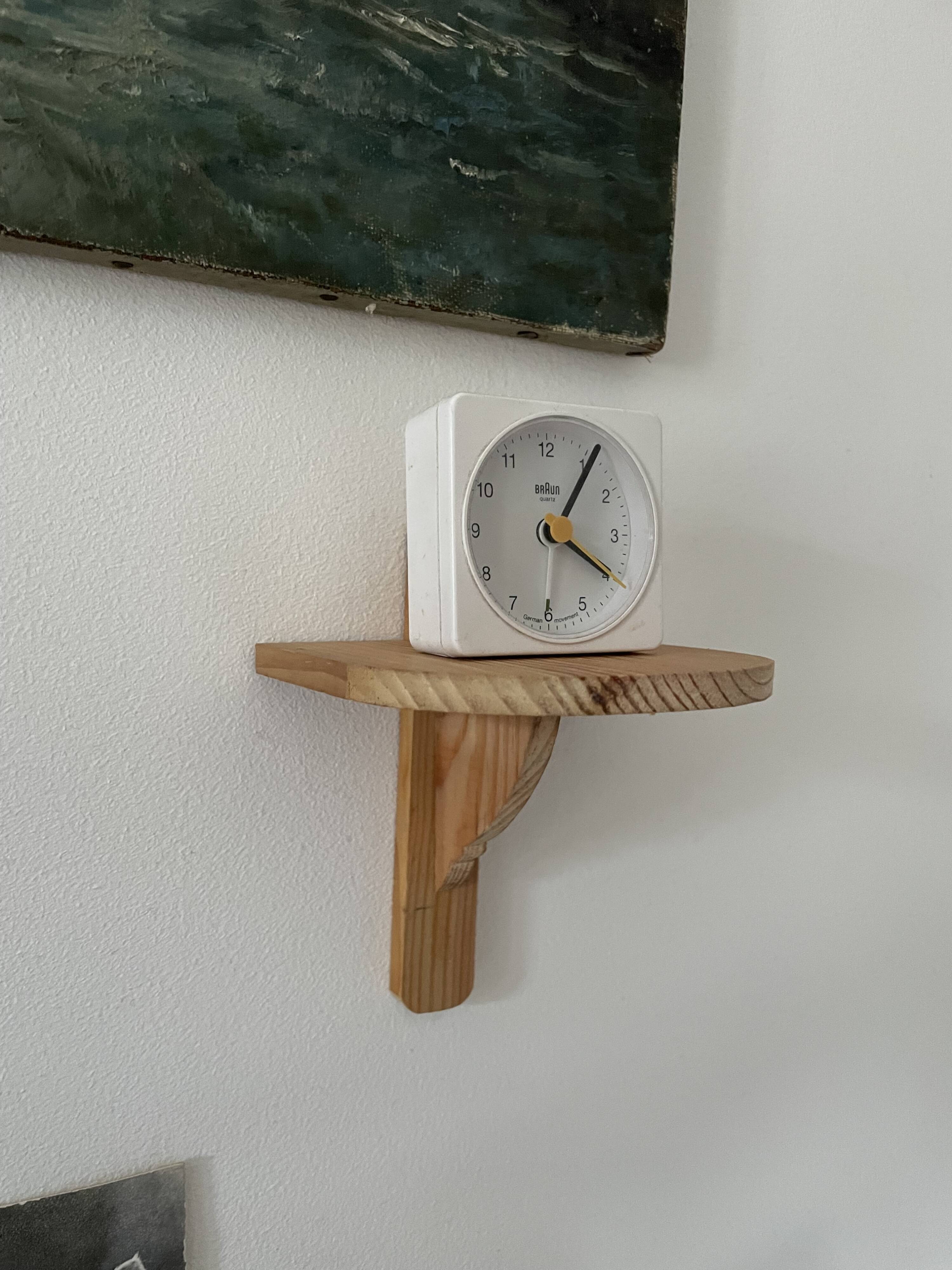 Small wall-mounted wooden shelf