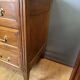 Louis XVI commode in walnut, beech, and brass.