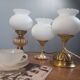 Trio lampes à poser style art deco bronze et opaline blanche