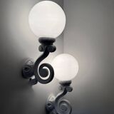 Cast iron and opaline wall lights from the 70s